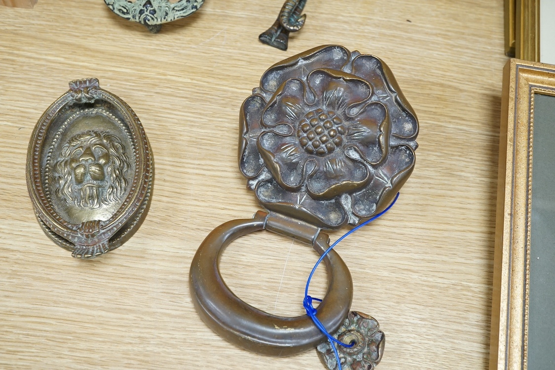 A group of four various cast brass door knockers. Condition- fair to good